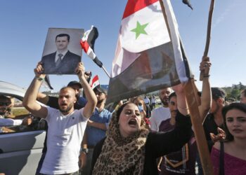 Предвыборный митинг в Сирии. Фото: Getty