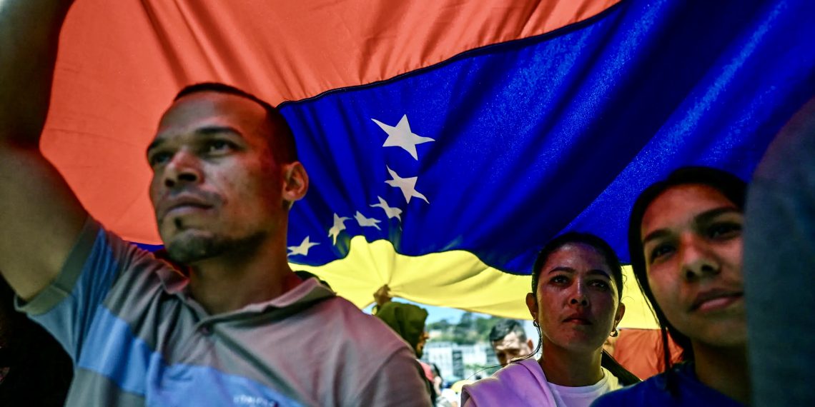 На митинге против санкций США, Каракас, март 2026 года. Фото: AFP / Getty